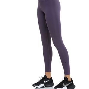 Nike size Medium leggings. Purple.